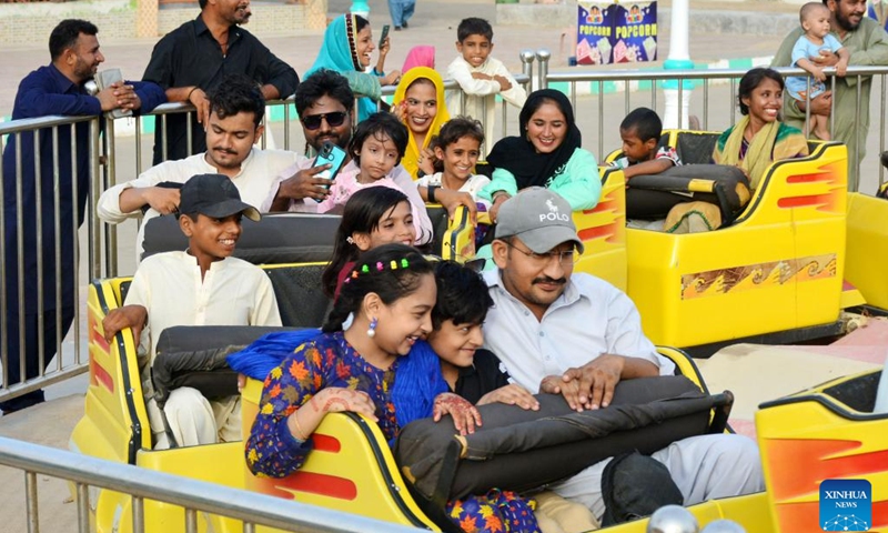 People have fun at an amusement park during the Eid al-Adha holiday in Hyderabad, Pakistan, on June 19, 2024. (Photo: Xinhua)