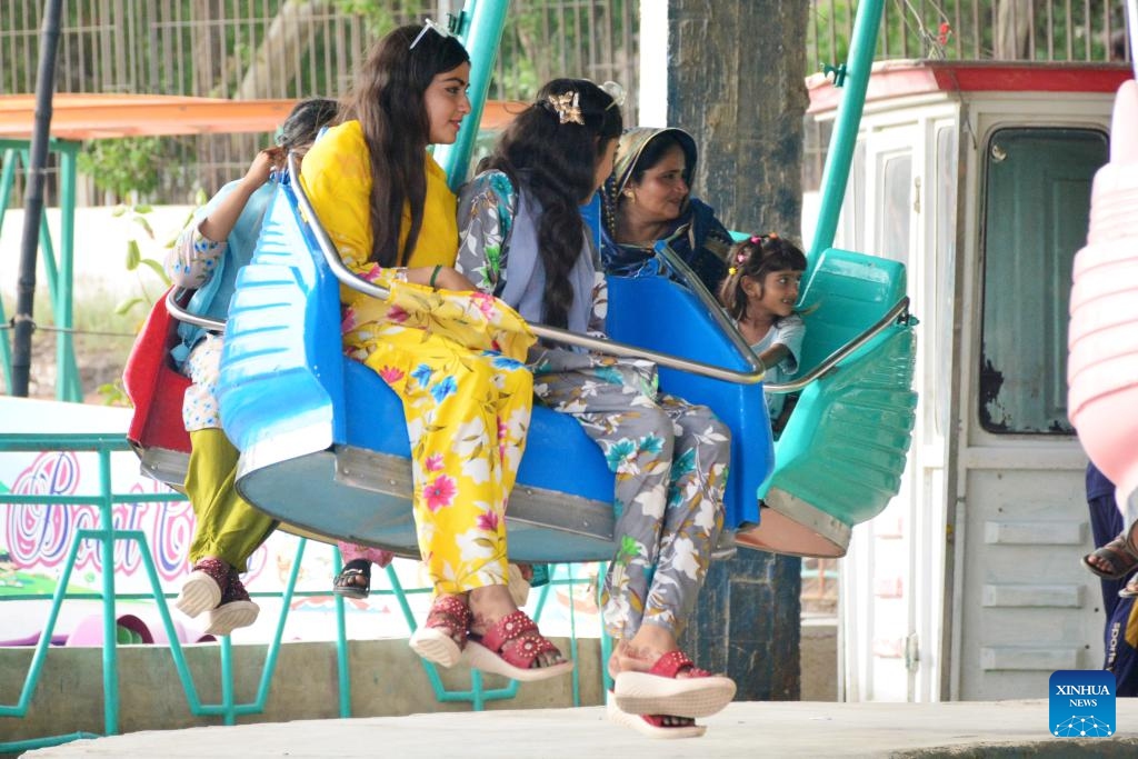 People have fun at an amusement park during the Eid al-Adha holiday in Hyderabad, Pakistan, on June 19, 2024. (Photo: Xinhua)