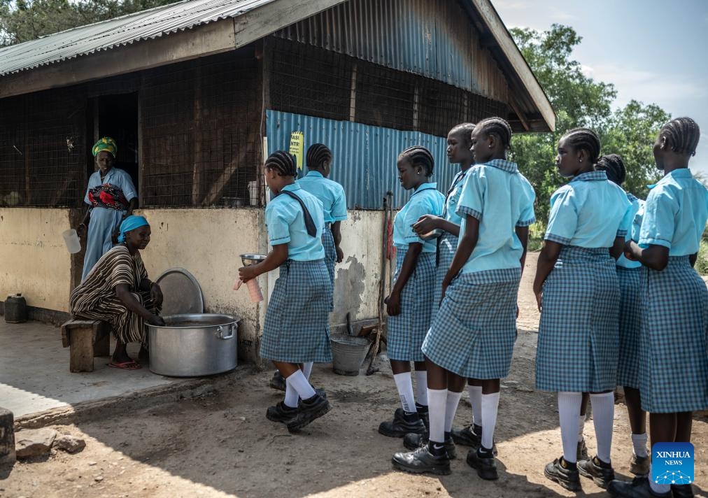 Students line up for food at Lifeworks Tumaini Girls Secondary School at Kakuma refugee camp in Turkana, Kenya, June 18, 2024. The school was established in 2014 and supported by UNHCR and the government of Kenya. There are more than 300 students from ten countries, including South Sudan, Ethiopia, Somalia, the Democratic Republic of the Congo and Kenya. (Photo: Xinhua)