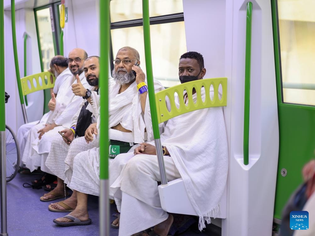 Hajj pilgrims are pictured aboard a train that runs on the Al Mashaaer Al Mugaddassah Metro Line in Mecca, Saudi Arabia, June 16, 2024. The China Railway Construction Corporation (CRCC) on Wednesday announced that it has completed the 2024 Hajj operation of the Al Mashaaer Al Mugaddassah Metro Line in the city of Mecca in Saudi Arabia. Over the seven days, 2,206 trains have been dispatched, serving about 2.094 million passengers, CRCC said in a statement.(Photo: Xinhua)