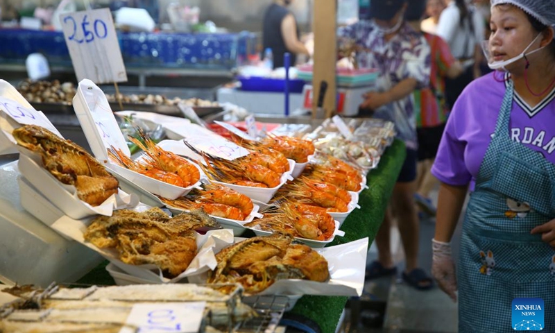 A vendor is seen at the Thonburi Market on the Thonburi side of Bangkok, Thailand, June 22, 2024. (Photo: Xinhua)