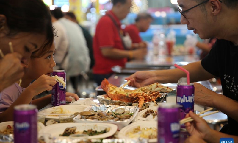 Customers dine at the Thonburi Market on the Thonburi side of Bangkok, Thailand, June 22, 2024.  (Photo: Xinhua)