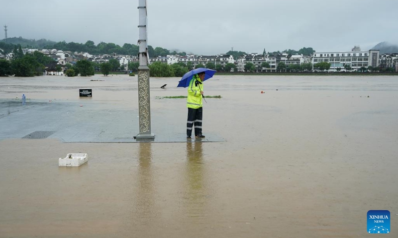 A person looks on at a waterlogged area in Shexian County, Huangshan City, east China's Anhui Province, June 23, 2024. Rainstorms hit Huangshan City on Sunday. (Photo: Xinhua)
