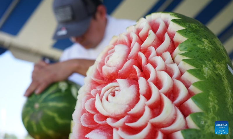 An artist carves a watermelon during the 2024 California Watermelon Festival in Los Angeles, California, the United States, June 22, 2024. (Photo: Xinhua)