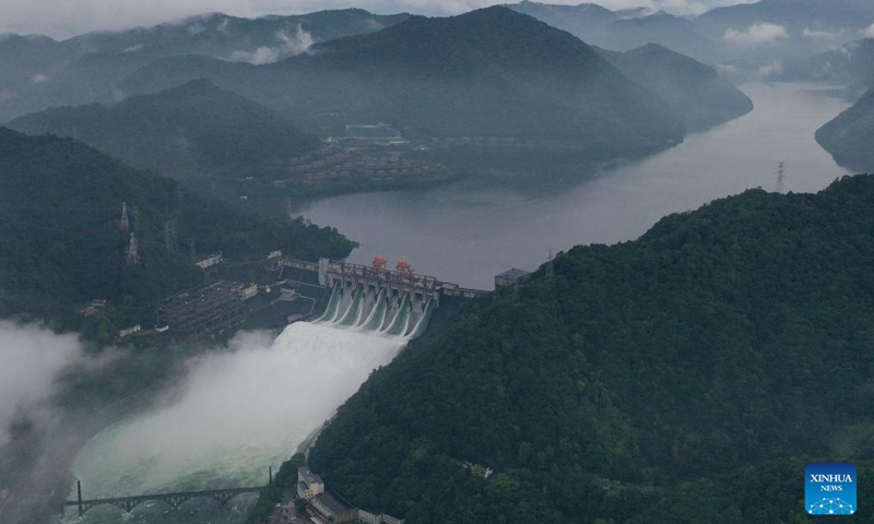 An aerial drone photo taken on June 24, 2024 shows the Xin'an River Reservoir releasing water for flood control in Jiande City, east China's Zhejiang Province. China's State Flood Control and Drought Relief Headquarters on Monday raised emergency responses to flooding to Level III in the eastern province of Zhejiang.(Photo: Xinhua)