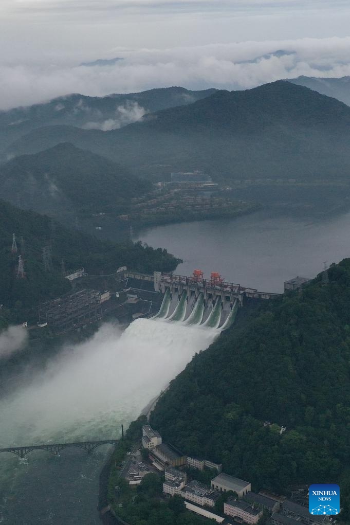 An aerial drone photo taken on June 24, 2024 shows the Xin'an River Reservoir releasing water for flood control in Jiande City, east China's Zhejiang Province. China's State Flood Control and Drought Relief Headquarters on Monday raised emergency responses to flooding to Level III in the eastern province of Zhejiang.(Photo: Xinhua)