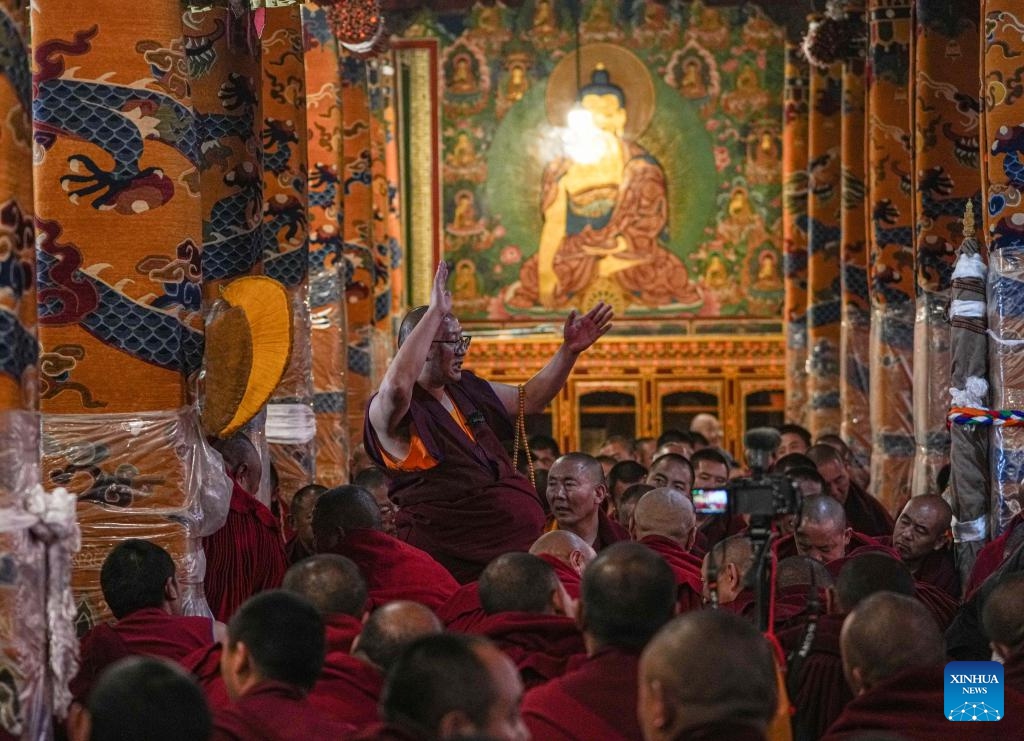 A monk asks questions to candidates during a preliminary examination for the Geshe Lharampa at Sera Monastery in Lhasa, capital of southwest China's Xizang Autonomous Region, June 25, 2024. A total of 13 monks from multiple monasteries are in the process of completing a preliminary examination for the Geshe Lharampa, the highest academic degree in the exoteric teachings of the Gelug school of Tibetan Buddhism.(Photo: Xinhua)