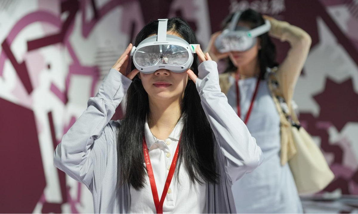 Visitors experience a VR tour back to the 1921 scene of the first National Congress of the Communist Party of China (CPC) in Shanghai, on July 1, 2024. (Photo: Lu Ting/GT)
