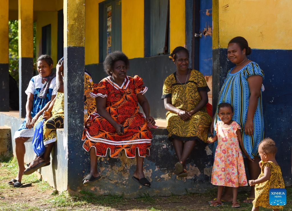People wait to participate in community activities at a village in the suburb of Port Vila, Vanuatu, June 30, 2024. (Photo: Xinhua)
