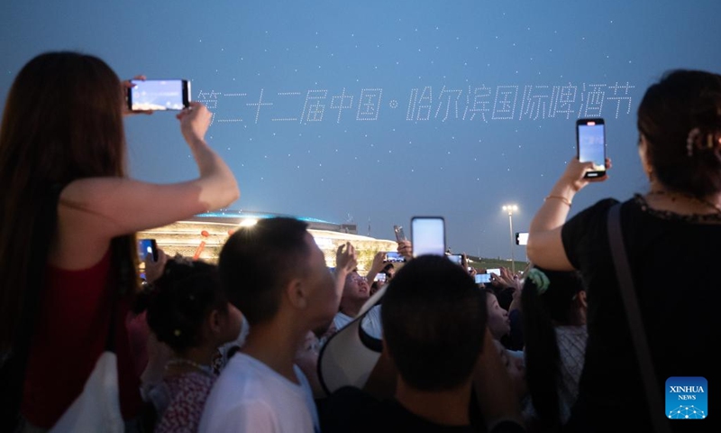 People watch a drone light show at the 22nd China Harbin International Beer Festival in Harbin, northeast China's Heilongjiang Province, July 6, 2024. The 22nd China Harbin International Beer Festival opened on Saturday. Photo: Xinhua