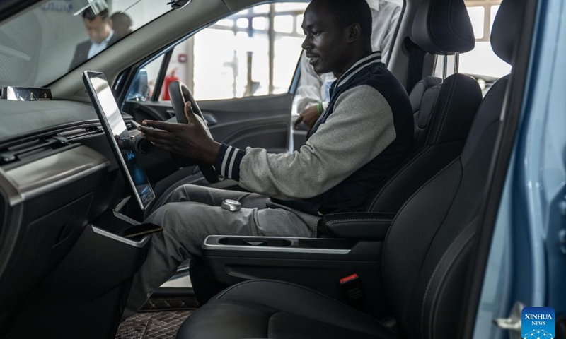 A customer sits in a car at a store of Chinese automotive brand Neta in Nairobi, Kenya, July 5, 2024. Chinese automotive brand Neta announced its entry into the Kenyan market on June 26, 2024. (Xinhua/Wang Guansen)