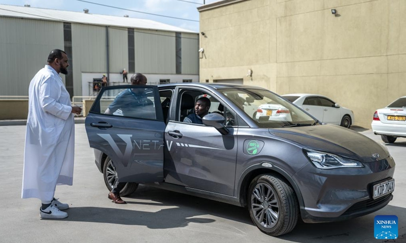 Customers prepare for a test drive at a store of Chinese automotive brand Neta in Nairobi, Kenya, July 5, 2024. Chinese automotive brand Neta announced its entry into the Kenyan market on June 26, 2024. (Xinhua/Wang Guansen)