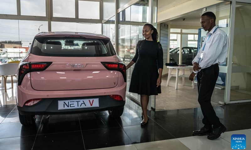 A customer looks at a car at a store of Chinese automotive brand Neta in Nairobi, Kenya, July 5, 2024. Chinese automotive brand Neta announced its entry into the Kenyan market on June 26, 2024. (Xinhua/Wang Guansen)