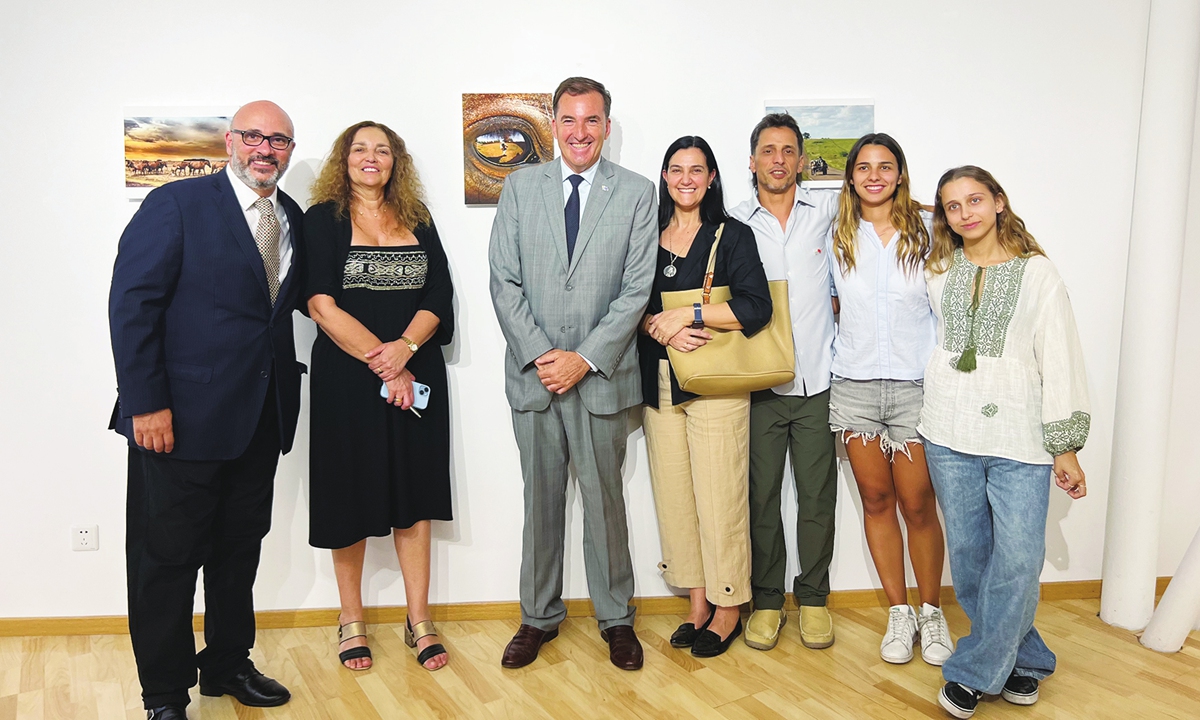 Guests pose for a photo at the opening ceremony of the Photography Exhibition Uruguay in Beijing on July 4, 2024. Photo: Courtesy of the Uruguayan Embassy in China 