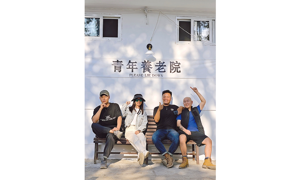 Young people pose for a group picture at Wen Chao retreat, located within the Mandiu Ancient Village, in the Dai Autonomous Prefecture of Xishuangbanna, Southwest China's Yunnan Province. Photo: Courtesy of Lu Boke