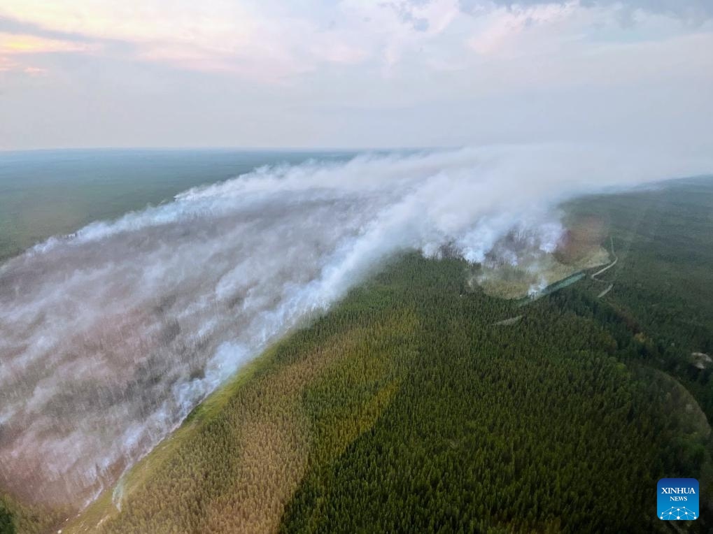 Aerial photo provided by Alberta Wildfire shows smoke rising from wildfires in northern Alberta, Canada, on July 2, 2024. Sweltering conditions from a heat wave gripping Western Canada presented challenging conditions for firefighters in northern Alberta on July 9. Wildfire danger warnings spread across Alberta over the weekend with extreme temperatures and out-of-control fires in the northern areas of the province. (Photo: Xinhua)