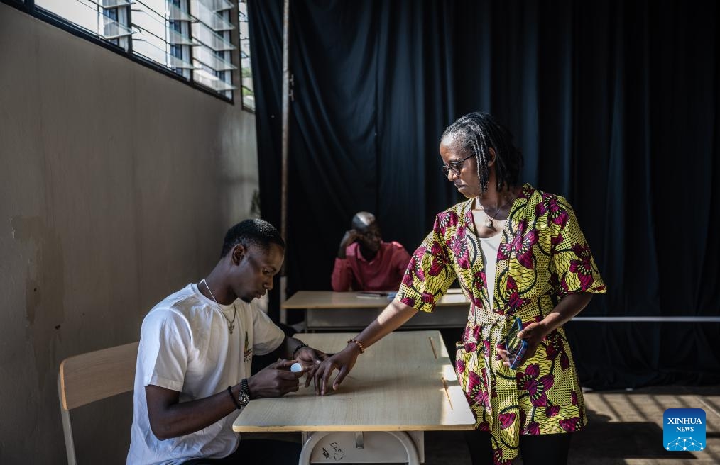 A voter gets her finger inked by a National Election Commission (NEC) official after casting her ballot during the Rwandan presidential and parliamentary elections at a polling station in Kigali, Rwanda, on July 15, 2024. (Photo: Xinhua)