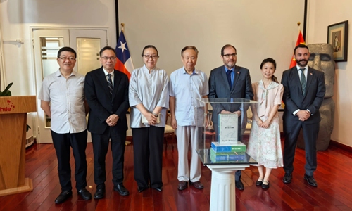 The Chilean Ambassador to China Mauricio Hurtado (third to right) and guests pose for photos at the book launch ceremony. Photo: Courtesy of the Chilean Embassy in Beijing