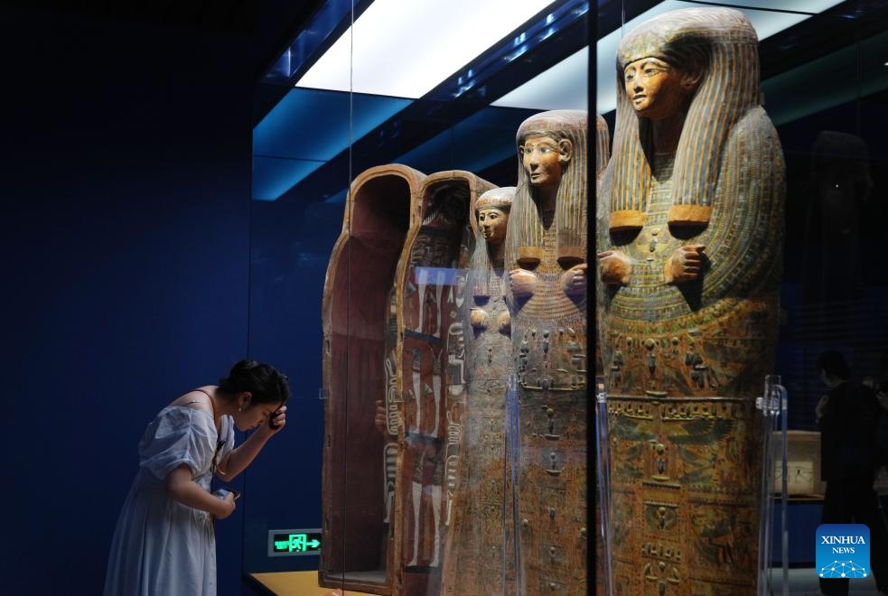 A visitor views colored mummy coffins during a media preview of the exhibition On Top of the Pyramid: The Civilization of Ancient Egypt at the Shanghai Museum in east China's Shanghai, July 16, 2024. The opening ceremony of the exhibition was held Wednesday at the Shanghai Museum on the People's Square of the city. (Photo: Xinhua)