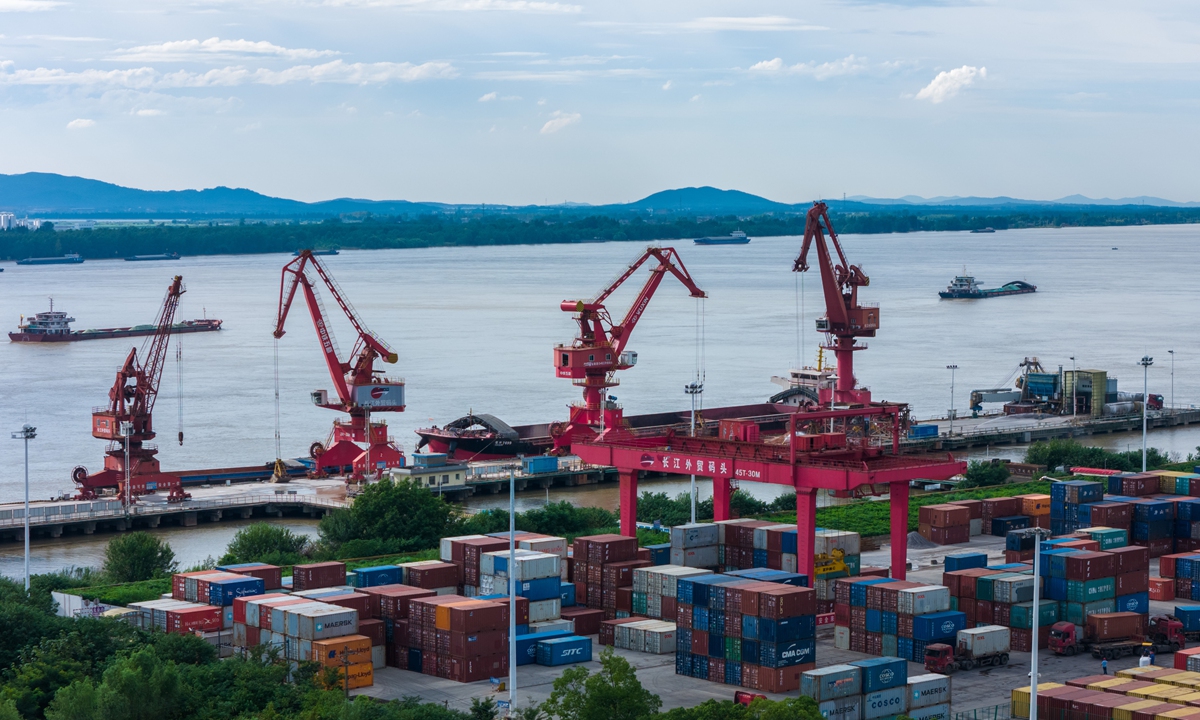 Cargo is loaded and unloaded at the Tongling port in East China's Anhui Province on July 19, 2024. Tongling, a river port along the Yangtze River, has committed to port construction over recent years, contributing to the city's export-oriented economy. Photo:VCG
