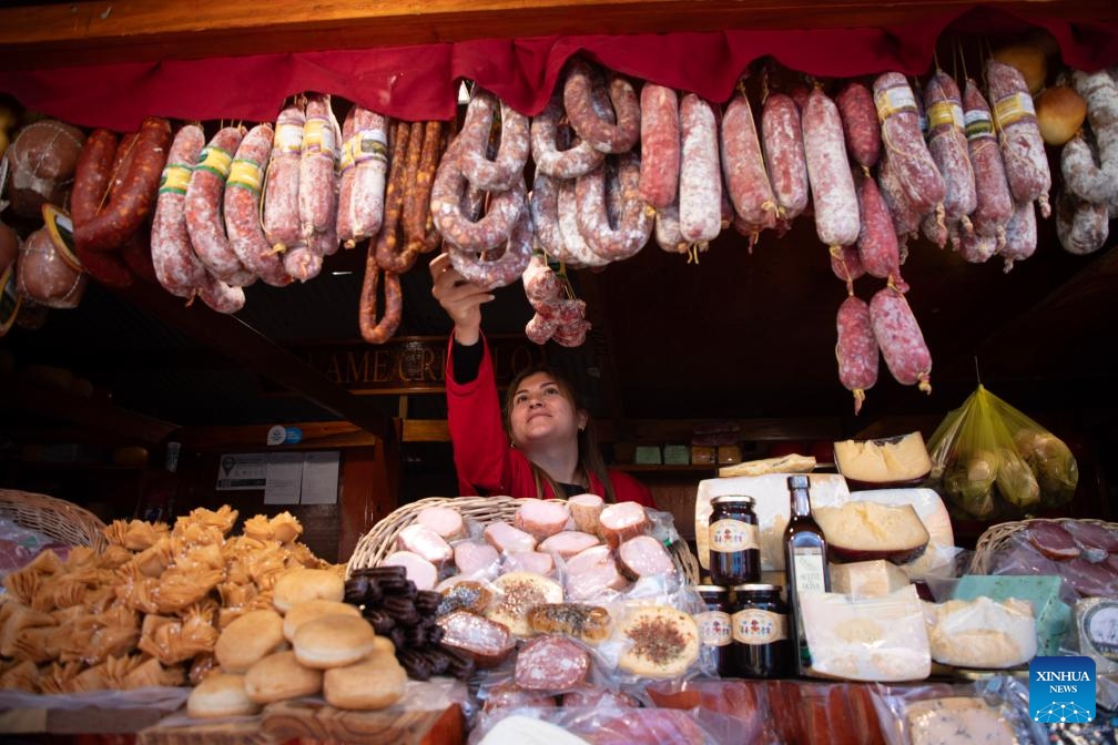 An employee waits for customers at a stand selling sausages and cheeses during the 136th edition of the Livestock, Agriculture and Industry Exhibition in Buenos Aires, Argentina on July 18, 2024. (Photo: Xinhua)