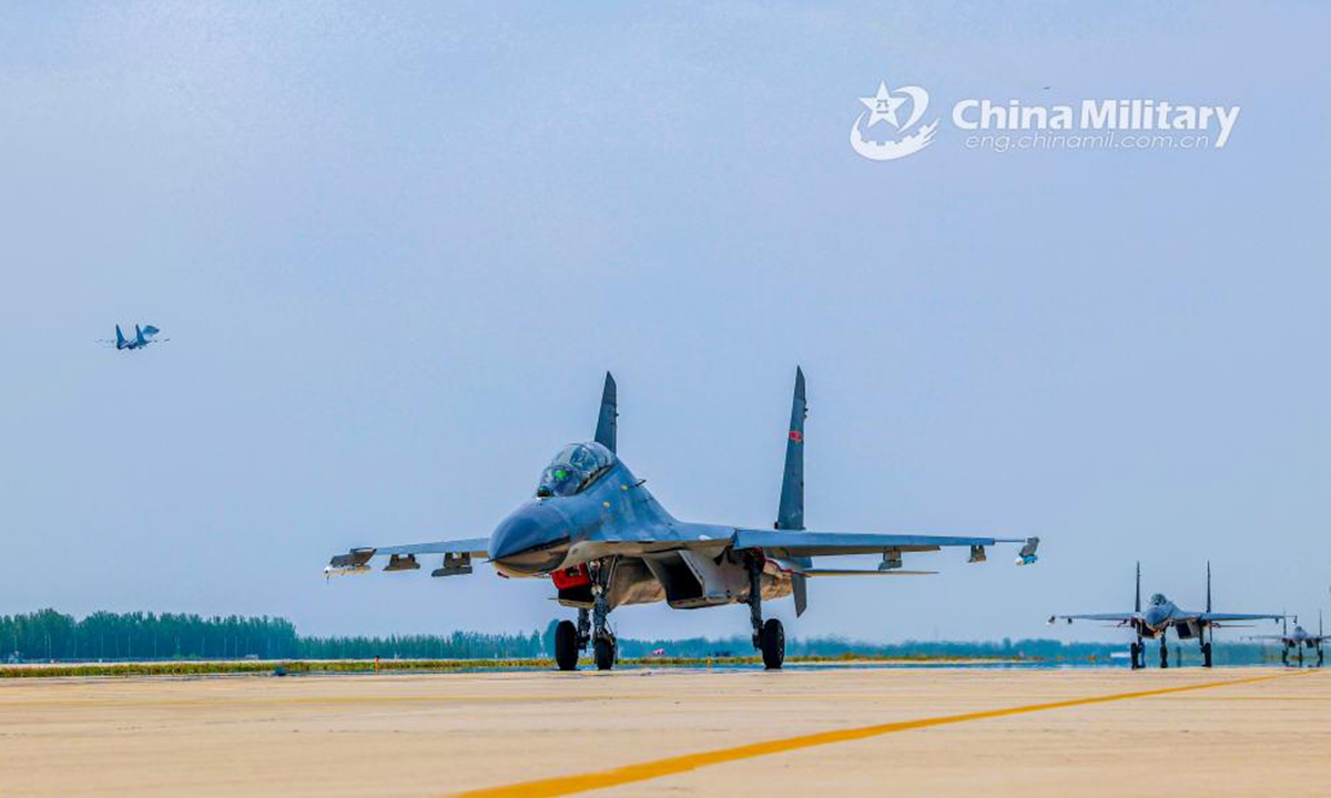Fighter jets attached to an aviation regiment under the PLA Air Force taxi on the runway to get ready for a flight training exercise in early June, 2024. (eng.chinamil.com.cn/Photo by He Wanli)