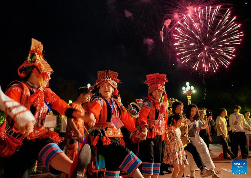 People dance at a torch festival in Chuxiong, southwest China's Yunnan Province, July 27, 2024. A torch festival of the Yi ethnic group kicked off here on Saturday. Photo: Xinhua