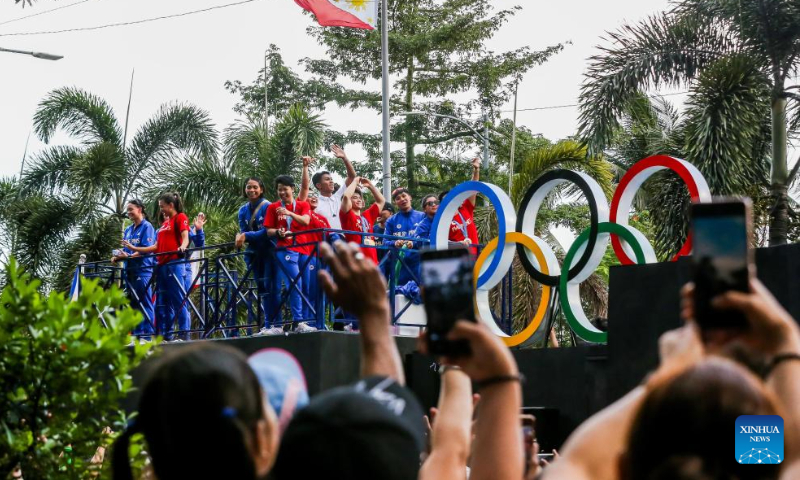 Filipino Olympians celebrate during a victory parade in Manila, the Philippines, Aug. 14, 2024. Thousands of people gathered on the streets to cheer for the Filipino athletes who competed at the 2024 Paris Olympics. (Photo: Xinhua)