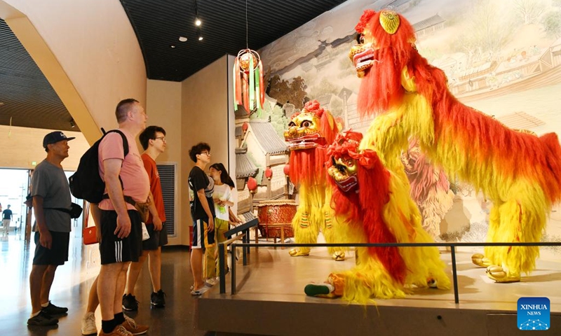 People view exhibits at China Grand Canal Intangible Cultural Heritage Exhibition Hall in Cangzhou, north China's Hebei Province, Aug. 2, 2024. With a total construction area of 31,000 square meters and a total exhibition area of 15,885 square meters, China Grand Canal Intangible Cultural Heritage Exhibition Hall showcases the essence of the intangible cultural heritage of eight provinces and municipalities alongside the Grand Canal, making it a popular place among citizens and visitors. Photo: Xinhua