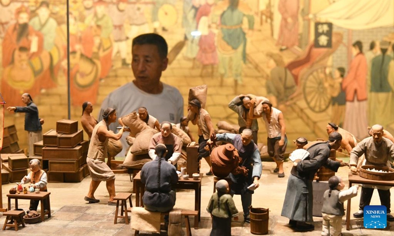 A visitor views exhibits at China Grand Canal Intangible Cultural Heritage Exhibition Hall in Cangzhou, north China's Hebei Province, Aug. 2, 2024. With a total construction area of 31,000 square meters and a total exhibition area of 15,885 square meters, China Grand Canal Intangible Cultural Heritage Exhibition Hall showcases the essence of the intangible cultural heritage of eight provinces and municipalities alongside the Grand Canal, making it a popular place among citizens and visitors. Photo: Xinhua