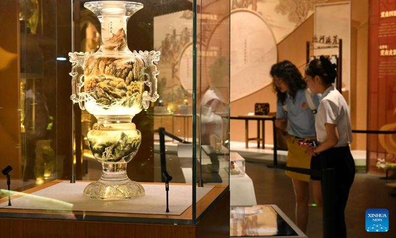 People view exhibits at China Grand Canal Intangible Cultural Heritage Exhibition Hall in Cangzhou, north China's Hebei Province, Aug. 2, 2024. With a total construction area of 31,000 square meters and a total exhibition area of 15,885 square meters, China Grand Canal Intangible Cultural Heritage Exhibition Hall showcases the essence of the intangible cultural heritage of eight provinces and municipalities alongside the Grand Canal, making it a popular place among citizens and visitors. Photo: Xinhua