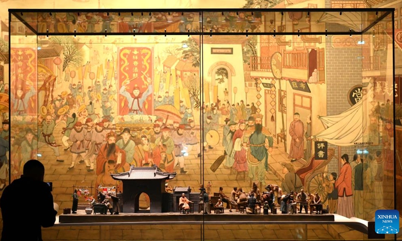 A visitor takes photos of exhibits at China Grand Canal Intangible Cultural Heritage Exhibition Hall in Cangzhou, north China's Hebei Province, Aug. 2, 2024. With a total construction area of 31,000 square meters and a total exhibition area of 15,885 square meters, China Grand Canal Intangible Cultural Heritage Exhibition Hall showcases the essence of the intangible cultural heritage of eight provinces and municipalities alongside the Grand Canal, making it a popular place among citizens and visitors. Photo: Xinhua