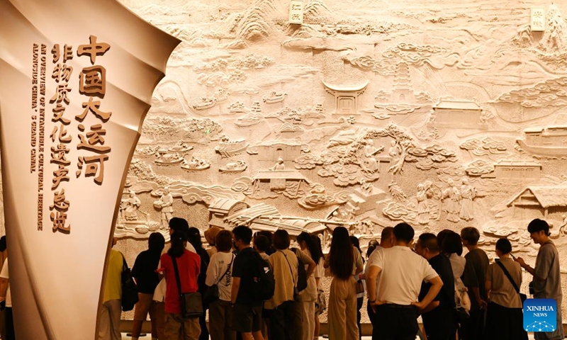 People visit China Grand Canal Intangible Cultural Heritage Exhibition Hall in Cangzhou, north China's Hebei Province, Aug. 2, 2024. With a total construction area of 31,000 square meters and a total exhibition area of 15,885 square meters, China Grand Canal Intangible Cultural Heritage Exhibition Hall showcases the essence of the intangible cultural heritage of eight provinces and municipalities alongside the Grand Canal, making it a popular place among citizens and visitors. Photo: Xinhua