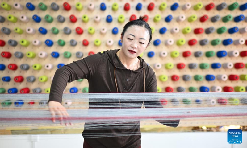 A staff member weaves woolen at a workshop assisted by Shanghai in Maqen County, the Tibetan Autonomous Prefecture of Golog, northwest China's Qinghai Province, July 19, 2024. Photo: Xinhua