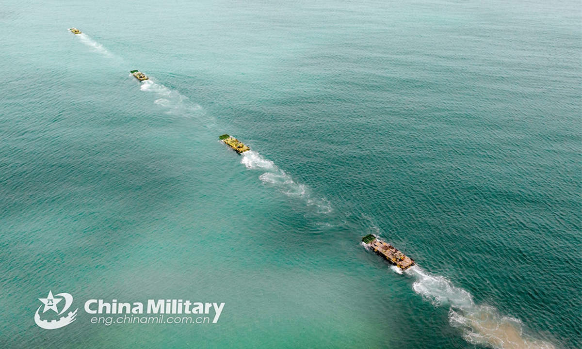 Amphibiousarmored infantry fighting vehicles (IFVs) attached to a brigade with the army under the PLA Eastern Theater Command maneuver in ferrying and assault wave formation during a tactical training exercise on June 19, 2024. (Photo: China Military Online)