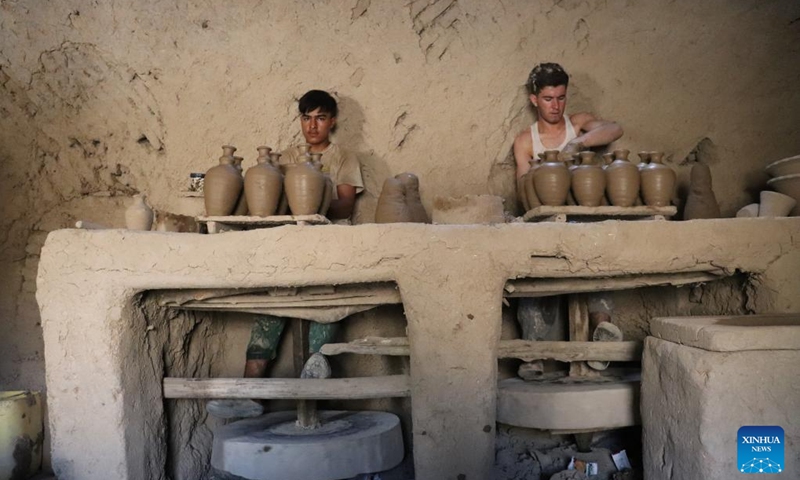Potters make potteries in Dawlat Abad District, north Afghanistan's Balkh province, Aug. 7, 2024. (Photo: Xinhua)