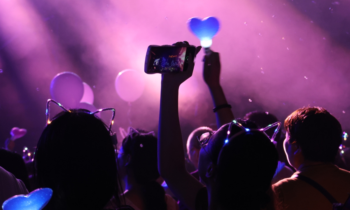 People enjoy themselves at a music festival celebrating the Qixi Festival in Yancheng, Jiangsu Province.  Photo: VCG