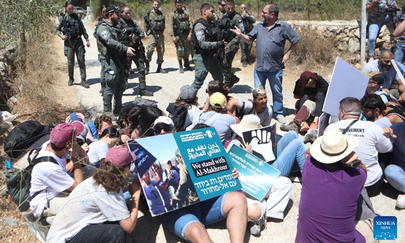 A man argues with an Israeli soldier during a demonstration against the Israeli confiscation of land in Beit Jala, near the West Bank city of Bethlehem, on Aug. 8, 2024. (Photo: Xinhua)