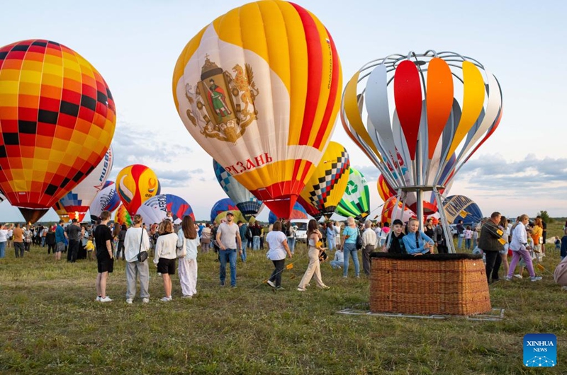 People visit the Sky of Russia hot-air balloon festival in Ryazan region, Russia, on Aug. 9, 2024. The 22nd ballooning festival Sky of Russia is held here from Aug. 4 to 12, and more than 30 teams are featured in the festival. Photo: Xinhua