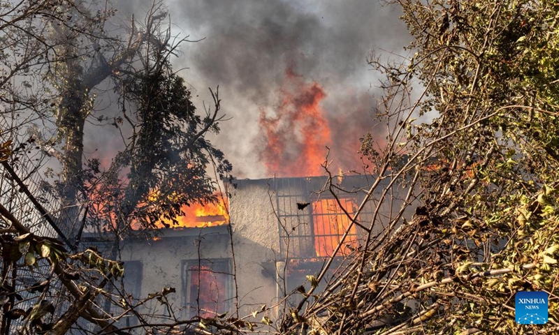 A house catches fire during a wildfire in Varnavas, around 35 km from Athens, Greece, on Aug. 11, 2024. Greek firefighters were battling a major wildfire for several hours on Sunday near Athens, which has forced the evacuation of five settlements, the Fire Brigade said. Five residents among the evacuees were transferred to hospitals with minor injuries, mostly from respiratory problems due to smoke inhalation, said Health Minister Adonis Georgiadis. The fire broke out around 3 pm local time in Varnavas, around 35 km from Athens, in the northeastern Attica region near Marathon. Photo: Xinhua