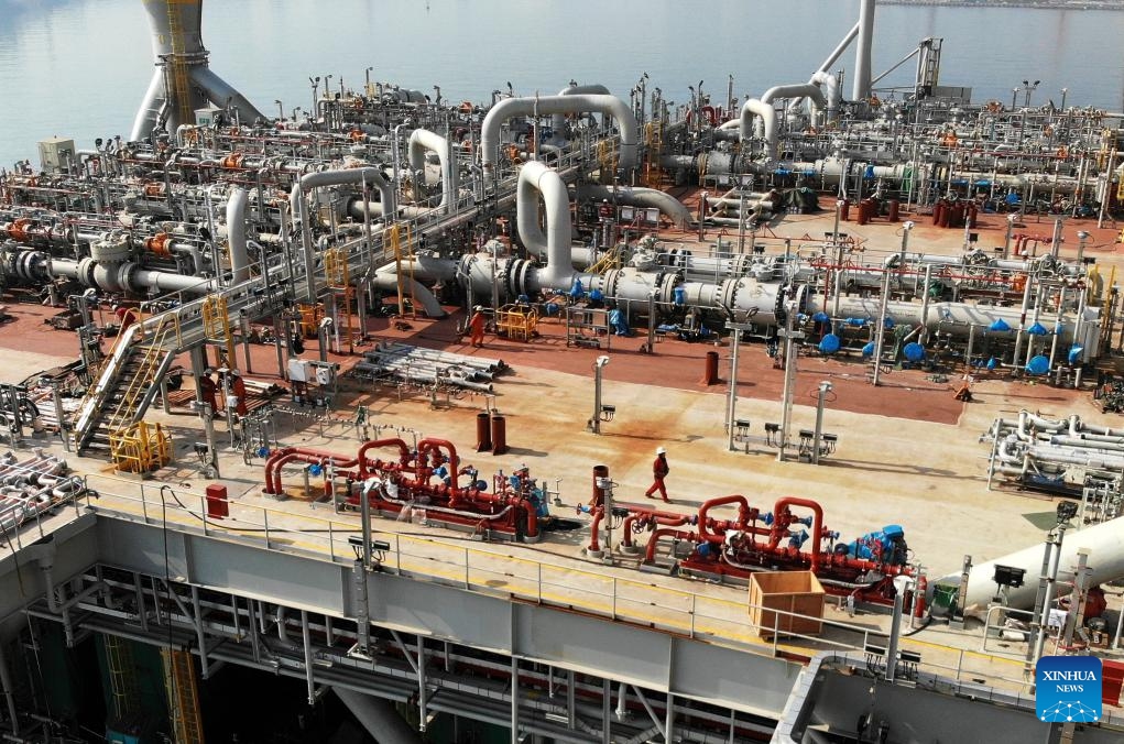 An aerial drone photo taken on Aug. 12, 2024 shows a staff member walking on the Marjan Offshore GOSP-4 Tie-in Platform in Qingdao, east China's Shandong Province. The platform built by China Offshore Oil Engineering Company (COOEC) was completed in Qingdao on Monday. （Photo: Xinhua)