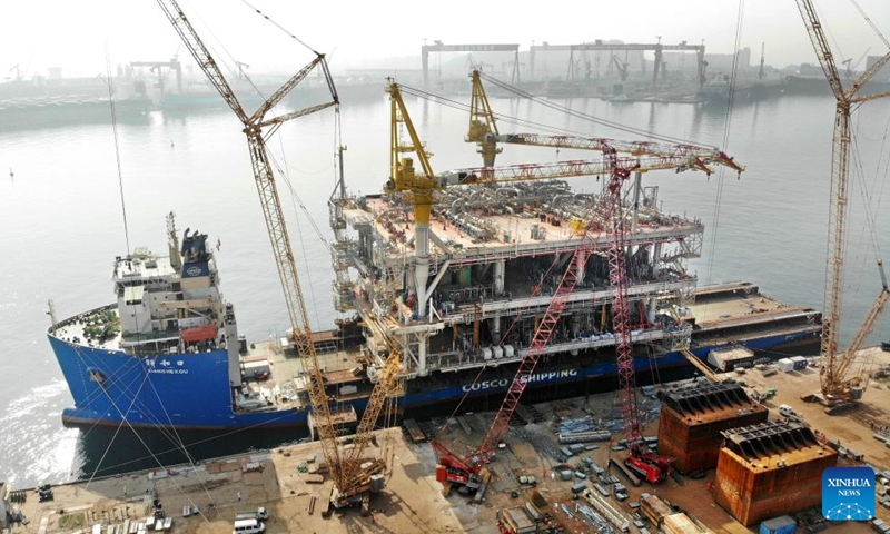 An aerial drone photo taken on Aug. 12, 2024 shows the Marjan Offshore GOSP-4 Tie-in Platform in Qingdao, east China's Shandong Province. The platform built by China Offshore Oil Engineering Company (COOEC) was completed in Qingdao on Monday. This oil and gas collecting and transferring platform, with a weight exceeding 17,000 tonnes, is expected to collect and transport 24 million tonnes of crude oil and 7.4 billion cubic meters of associated gas every year. （Photo: Xinhua)