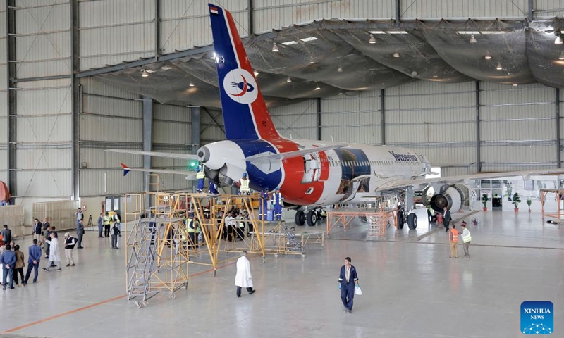 Engineers check an aircraft at the aircraft maintenance center of the Sanaa International Airport, in Sanaa, Yemen, on Aug. 11, 2024. The General Authority of Civil Aviation and Meteorology of Yemen, along with Yemeni Airlines, announced the reopening of the plane maintenance center at the Sanaa International Airport on Sunday. （Photo: Xinhua)