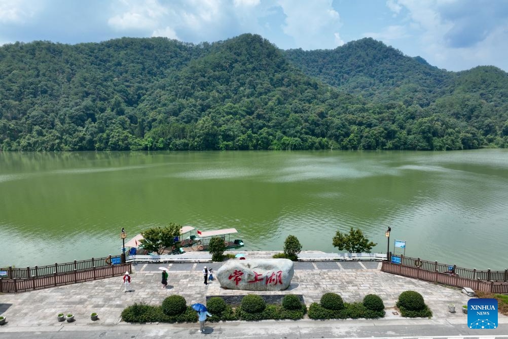 A drone photo shows people visiting Changkou Village of Jiangle County, Sanming City, southeast China's Fujian Province, Aug. 10, 2024. Sanming City has been exploring a new path of development that embraces green transformation to boost rural tourism including forest-based health services and other economic activities. Currently, forests cover 77.12 percent of the total area in the city. （Photo: Xinhua)