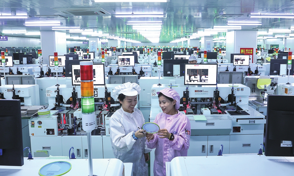 Workers fill orders on an intelligent production line at a technology company in Jiujiang, East China's Jiangxi Province on August 13, 2024. The company specializes in LED optoelectronic semiconductor devices. Using these intelligent workshops enables the company to sell its products to more than 30 countries and regions around the world. Photo: VCG