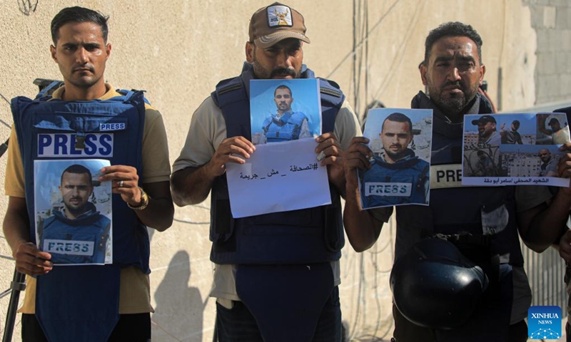 Palestinian journalists protest against Israeli army's attacks on journalists in the southern Gaza Strip city of Khan Younis, on Aug. 19, 2024. The United Nations Relief and Works Agency for Palestine Refugees in the Near East (UNRWA) reported on Monday that over 160 journalists and media workers have been killed while covering the humanitarian impact of the conflict and ongoing violations of international humanitarian law. (Photo: Xinhua)