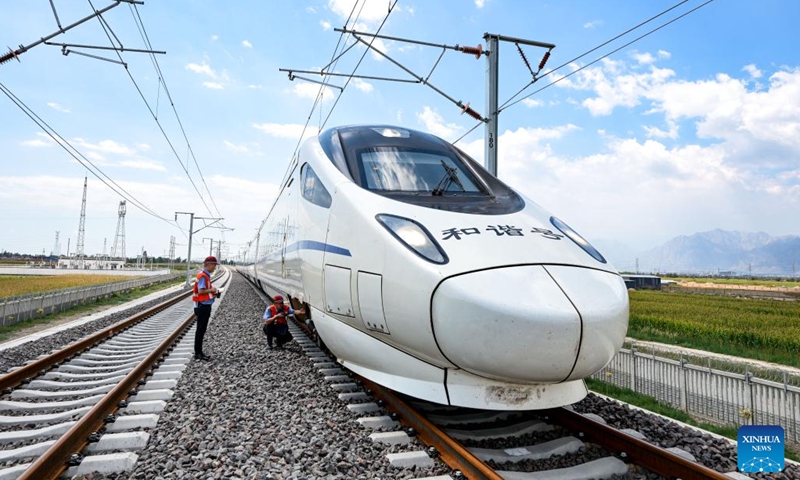 Onboard mechanics check an EMU train during a test run on the Huinong-Yinchuan section of the high-speed railway linking Baotou of north China's Inner Mongolia Autonomous Region and Yinchuan of northwest China's Ningxia Hui Autonomous Region, in Shizuishan City, northwest China's Ningxia Hui Autonomous Region, Aug. 19, 2024. (Photo: Xinhua)
