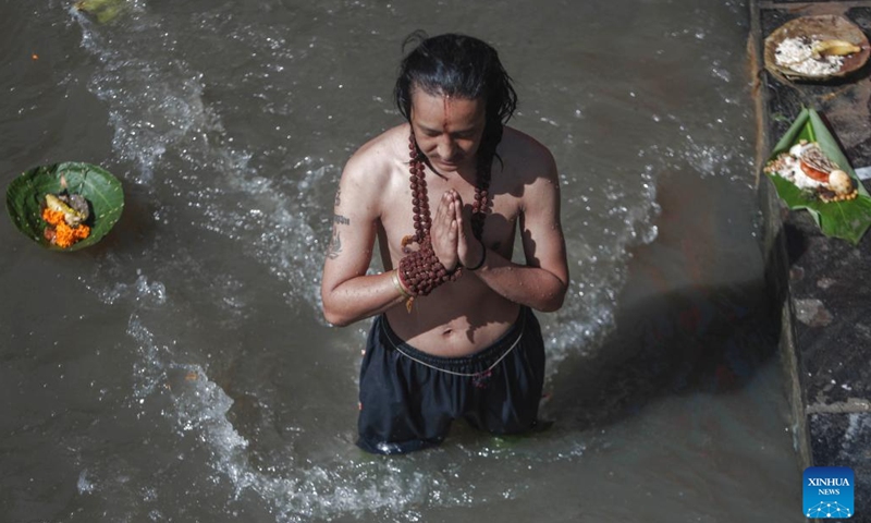 A man offers prayers during Kuse Aunsi, or Father's Day, at Gokarna Temple on the bank of Bagmati River in Kathmandu, Nepal, Sept. 2, 2024. Kuse Aunsi is a Hindu festival in which fathers, living or past, are honored. (Photo: Xinhua)