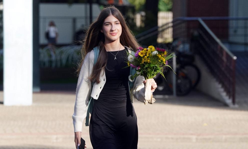 A student holding a bouquet is seen on the first day of the new school year in Riga, Latvia, Sept. 2, 2024. The new school year started for students from the first to 12th grade in Latvia on Monday. Students go to school with flowers on the first day of the new school year . (Photo: Xinhua)