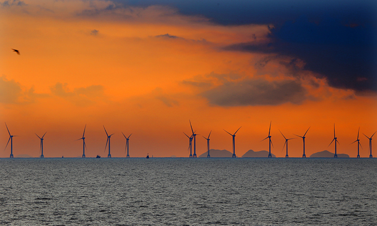 The sky, sunset, sea, and wind turbines create a stunning and grand scene in early autumn in East China's Zhejiang Province, on September 4, 2024. Photo: VCG